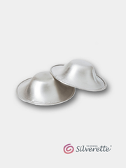 Pair of Silverette nursing cups made from 925 sterling silver, shown on a light grey background