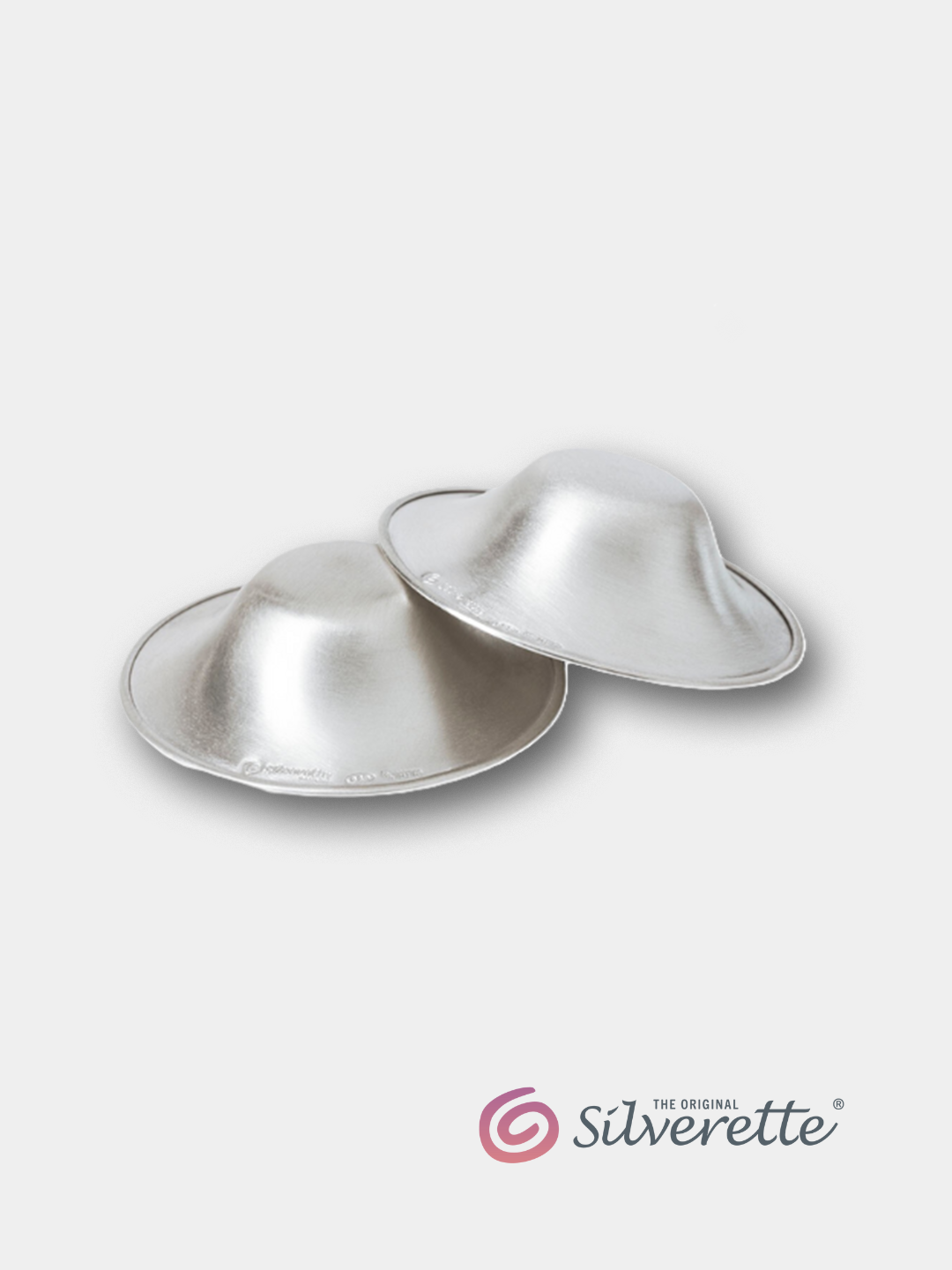 Pair of Silverette nursing cups made from 925 sterling silver, shown on a light grey background